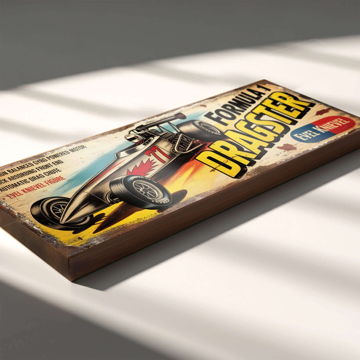 Rectangular vintage toy advert sign for Evel Knievel Formula 1 Dragster on 18mm MDF, featuring retro racing graphics and heavy faux-distressed weathering.