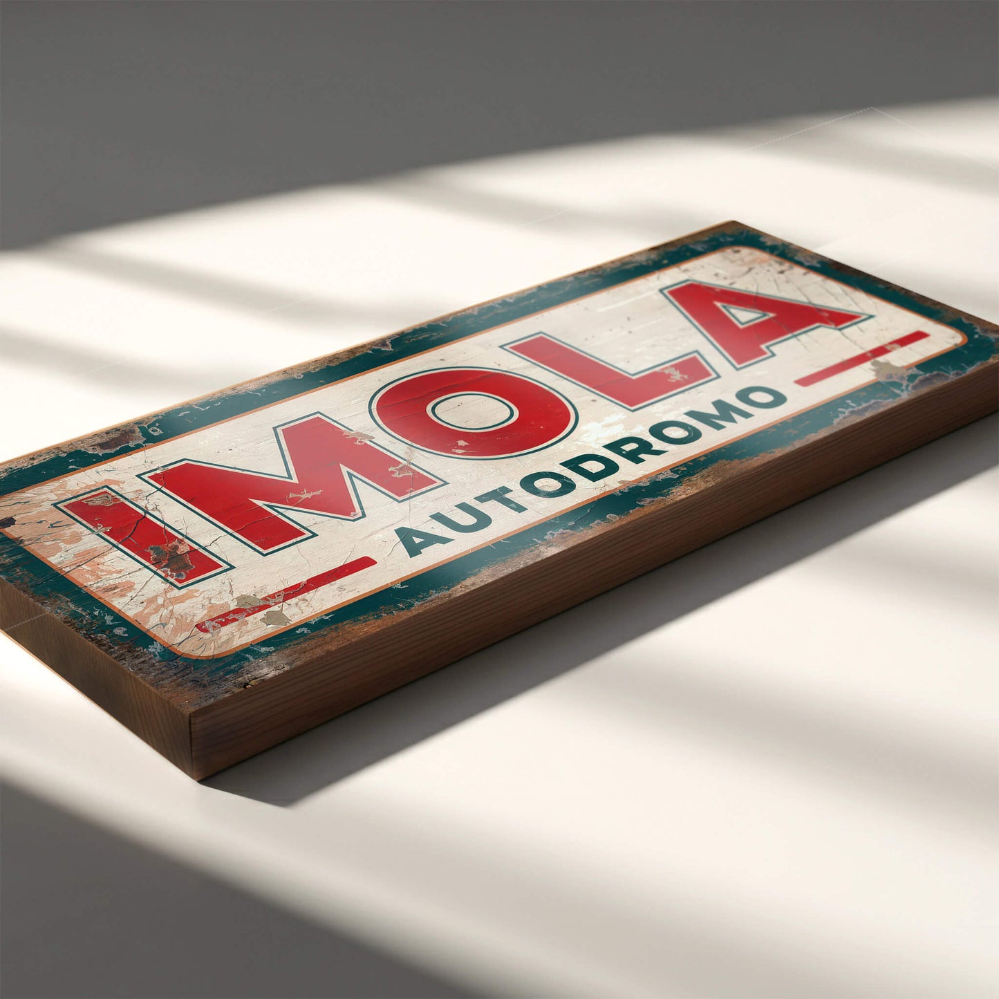 Distressed vintage racing sign for Imola Autodromo featuring a green border, cream center, and bold red typography, representing the Italian flag colors.