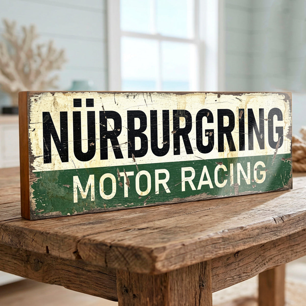 Rectangular vintage style Nürburgring Motor Racing sign with distressed off-white and green printed graphic on 18mm MDF, freestanding on a rustic wooden table.