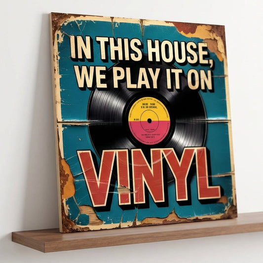 A square 31cm x 31cm vintage-style music sign on 9mm MDF with a vinyl record graphic and "IN THIS HOUSE, WE PLAY IT ON VINYL" text. Features a teal background with heavy integrated faux-flaking paint and rust effects.