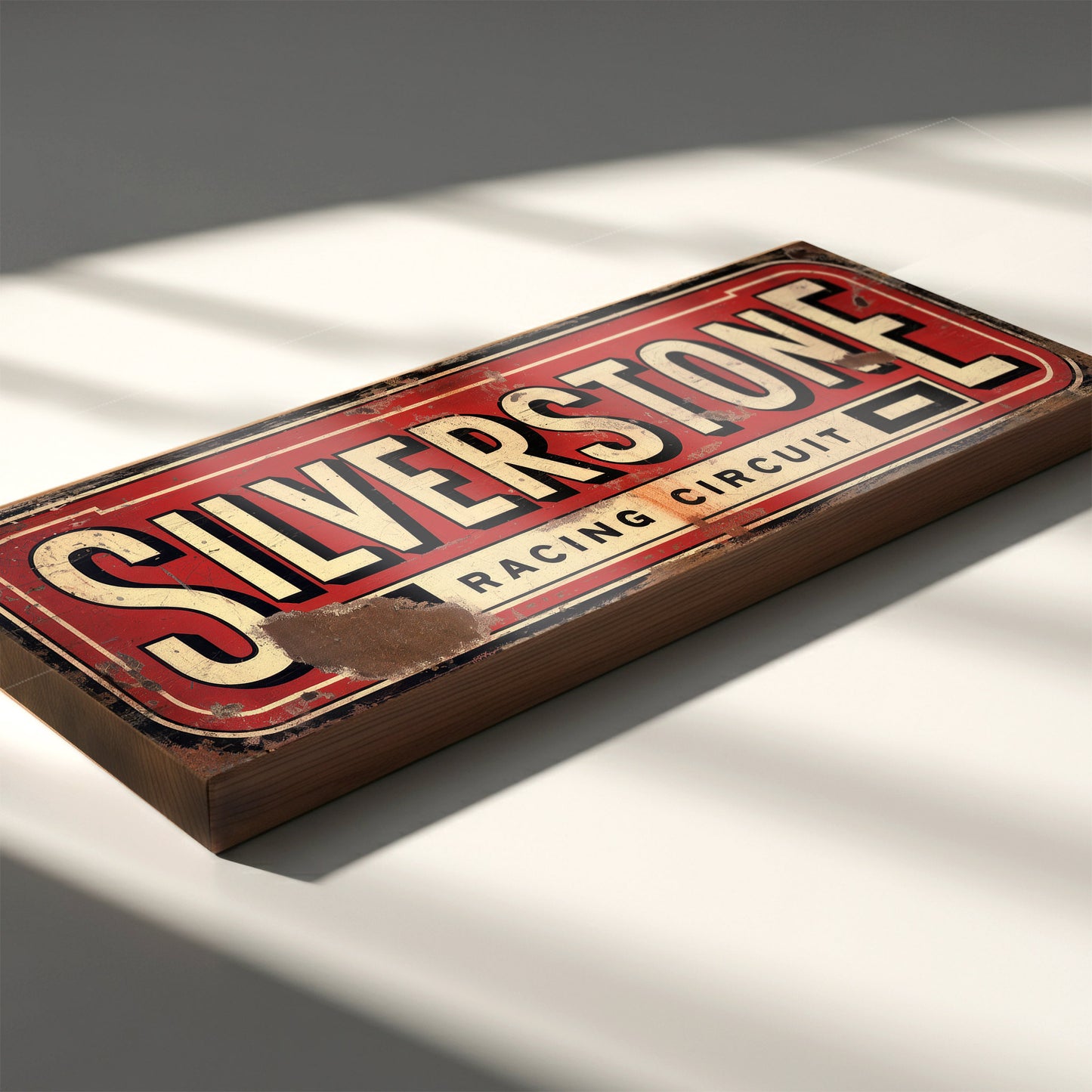 A rectangular red and cream sign on an 18mm MDF base with "SILVERSTONE RACING CIRCUIT" in bold vintage lettering. The design features heavy integrated faux-rust and weathering effects.