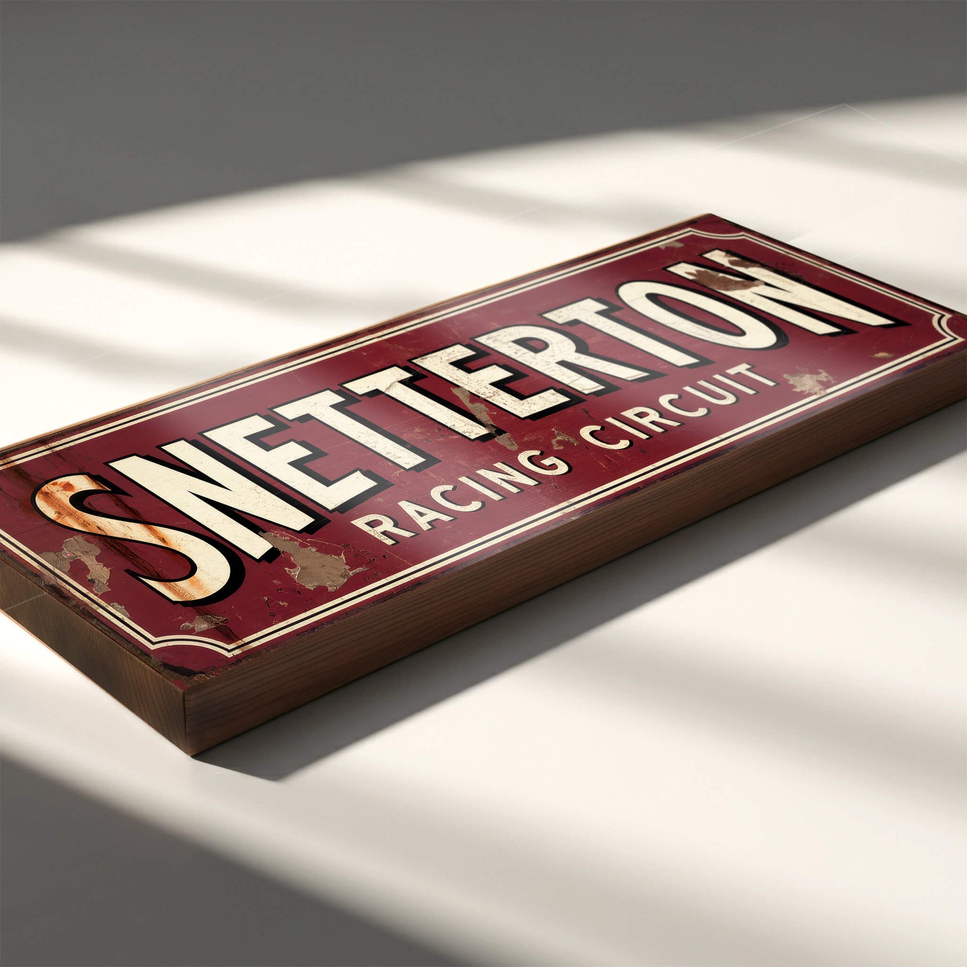 A rectangular crimson red sign on an 18mm MDF base with "SNETTERTON RACING CIRCUIT" in bold cream vintage lettering. The design features heavy integrated faux-rust and weathering effects.